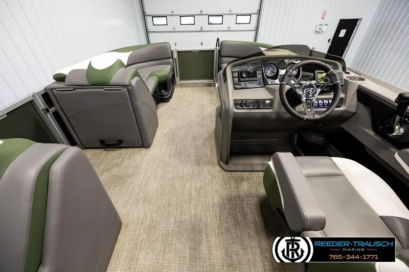 Slide: The Image of 2024 Avalon LSZ CRB boat interior with modern dashboard and comfortable seating. - 17