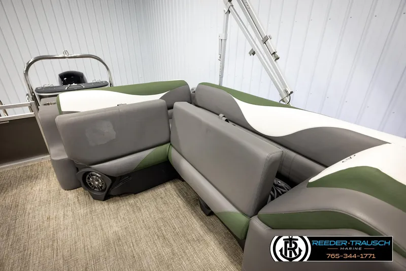 Slide: The Image of 2024 Avalon LSZ CRB boat interior with gray and green seating, featuring a speaker system. - 21
