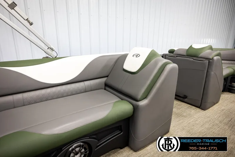 Slide: The Image of 2024 Avalon LSZ CRB boat interior with green and gray seating, featuring modern design. - 24