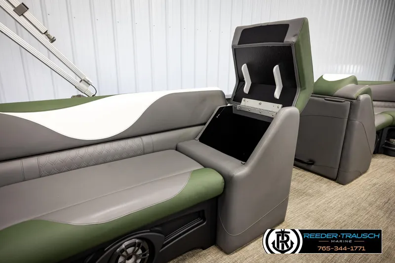 Slide: The Image of 2024 Avalon LSZ CRB boat interior with open storage compartment and stylish seating. - 25