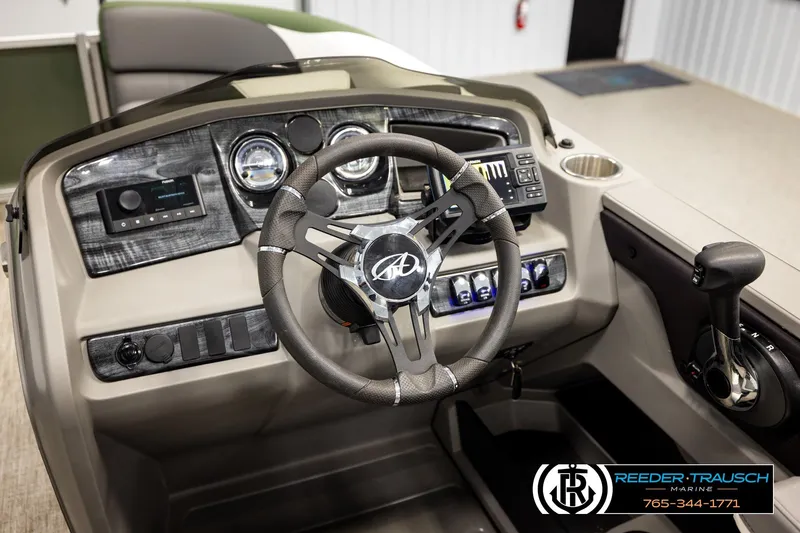 Slide: The Image of 2024 Avalon LSZ CRB boat dashboard with steering wheel and control panel. - 29