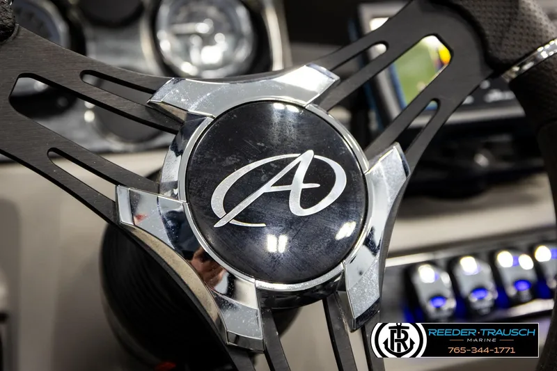 Slide: The Image of Steering wheel of 2024 Avalon LSZ CRB boat with logo and control panel. - 30