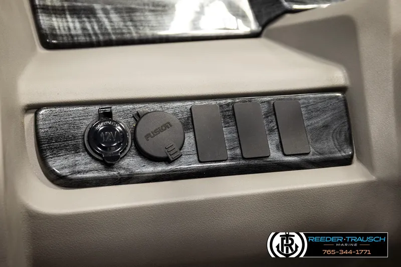 Slide: The Image of 2024 Avalon LSZ CRB dashboard with 12V and Fusion ports, Reeder-Trausch Marine branding. - 31