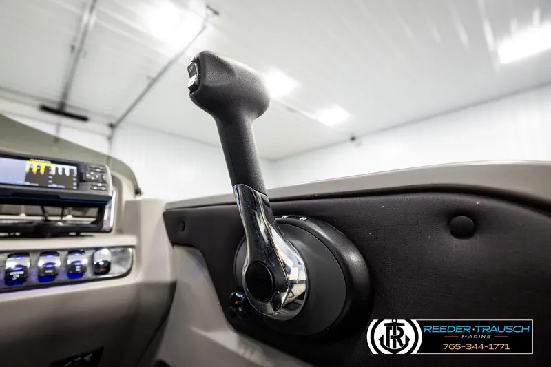 Slide: The Image of Close-up of 2024 Avalon LSZ CRB boat throttle control in a modern interior setting. - 38