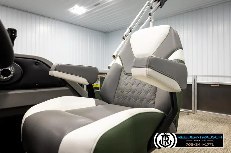 Slide: The Image of 2024 Avalon LSZ CRB boat seat with gray and white upholstery in a showroom. - 39