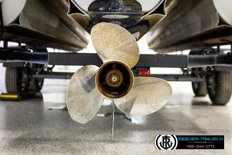 Slide: The Image of 2024 Avalon LSZ CRB boat propeller close-up in a showroom setting. - 48