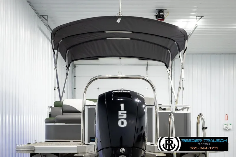 Slide: The Image of 2024 Avalon LSZ CRB pontoon boat with Mercury 150 engine in a showroom. - 7