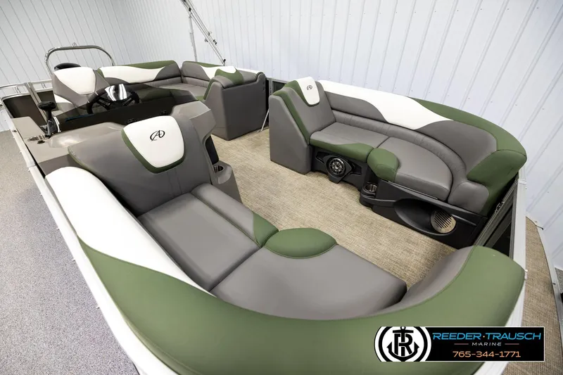Slide: The Image of 2024 Avalon LSZ CRB pontoon boat interior with green and gray seating, showcasing luxury design. - 9