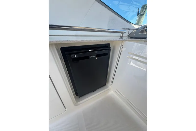 Slide: The Image of Compact refrigerator on 2010 Searay 330 Sundancer yacht, sleek design, modern amenities. - 12