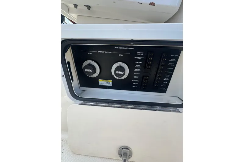 Slide: The Image of Main DC breaker panel on 2010 Searay 330 Sundancer boat, featuring battery switches and controls. - 15