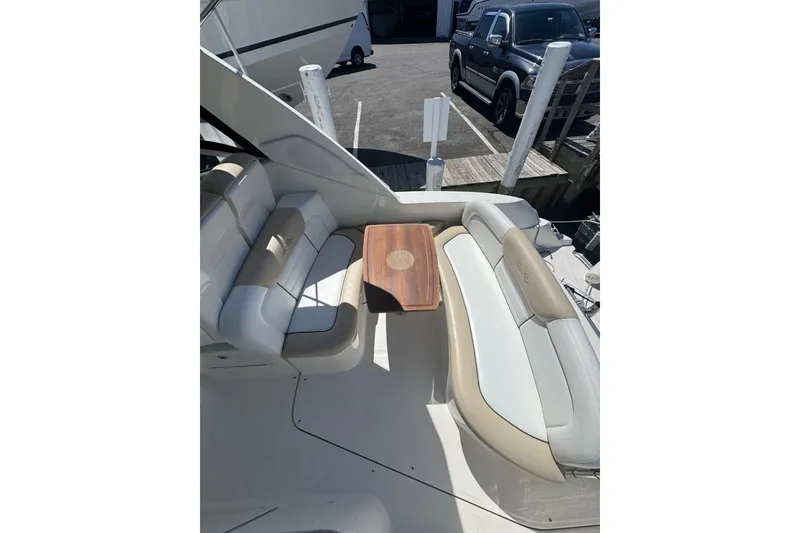 Slide: The Image of 2010 Searay 330 Sundancer helm with controls and warning label, showcasing dashboard details. - 19