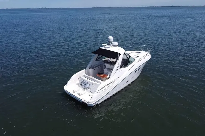 Slide: The Image of 2010 Sea Ray Sundancer 330 on calm waters. - 2