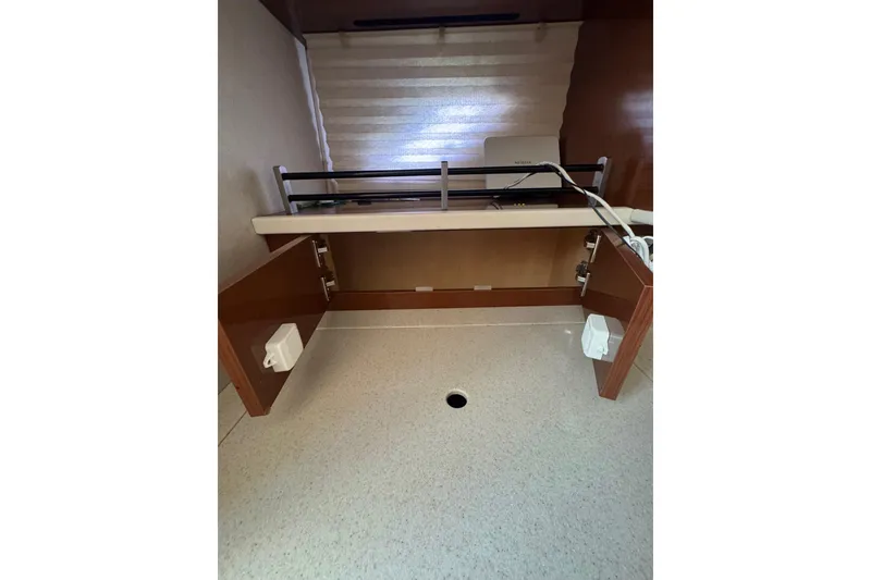 Slide: The Image of Microwave in 2010 Searay 330 Sundancer yacht kitchen with wooden cabinetry. - 30