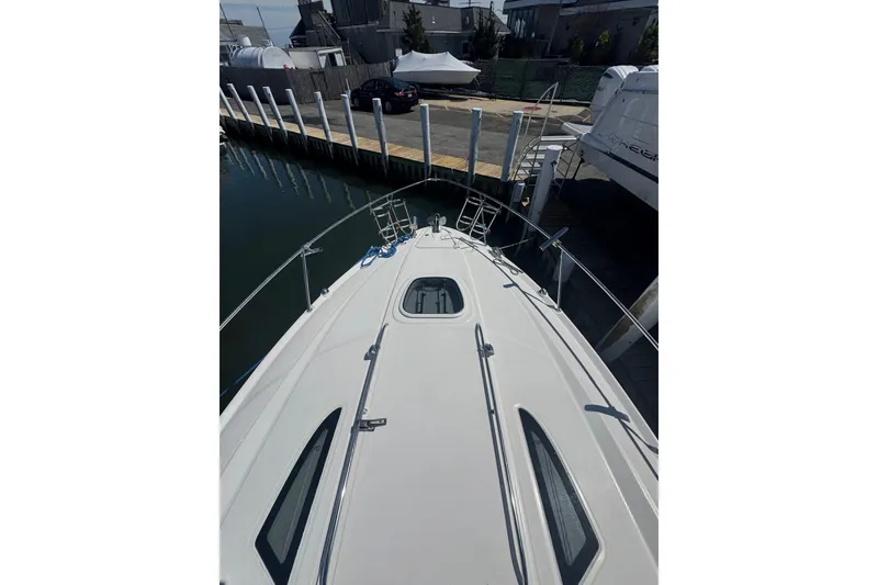Slide: The Image of Interior of 2010 Searay 330 Sundancer yacht with modern kitchen and cozy seating area. - 47