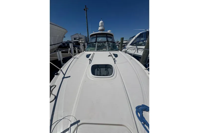 Slide: The Image of 2010 Searay 330 Sundancer yacht docked at marina, view from bow. - 48