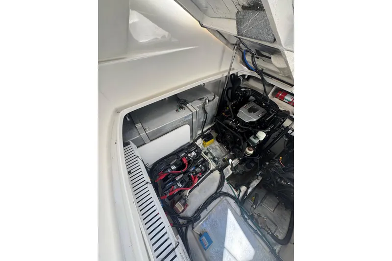 Slide: The Image of Engine compartment of 2010 Searay 330 Sundancer with dual engines and wiring. - 51