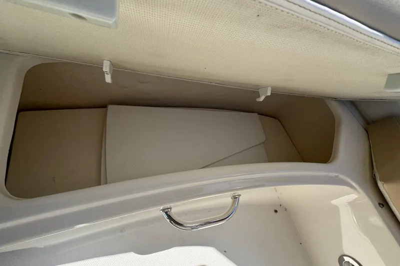 Slide: The Image of Storage compartment in 2010 Searay 330 Sundancer boat, featuring a sleek handle design. - 9