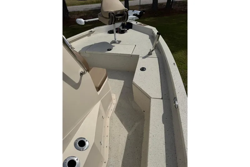 Slide: The Image of 2023 Xpress H20B Bay boat interior with seating and fishing rod holders. - 10