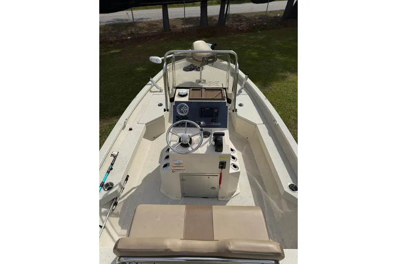 Slide: The Image of 2023 Xpress H20B Bay boat interior with steering console and seating. - 7