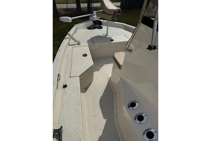 Slide: The Image of 2023 Xpress H20B Bay boat interior with seating and storage compartments. - 9