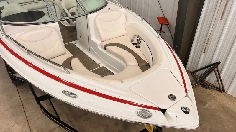 Slide: The Image of 2013 Cruisers Yachts 258 Sport Series boat with white and red design. - 10