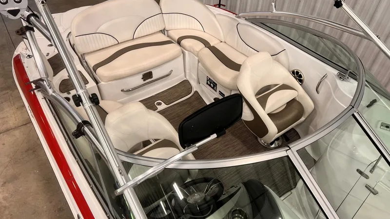 Slide: The Image of Interior of a 2013 Cruisers Yachts 258 Sport Series with white leather seating. - 11