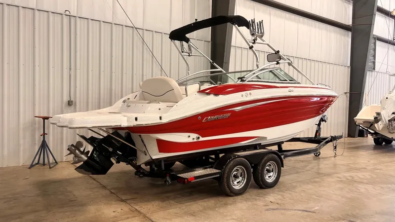 Slide: The Image of 2013 Cruisers Yachts 258 Sport Series boat in warehouse. - 3