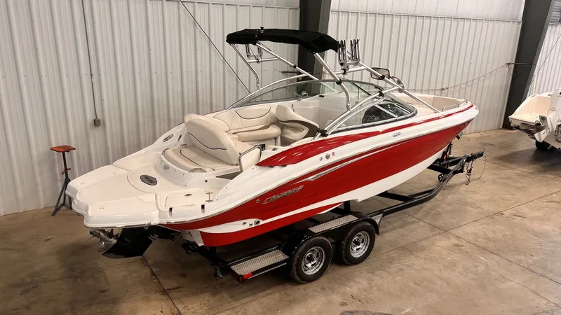 Slide: The Image of 2013 Cruisers Yachts 258 Sport Series boat in a warehouse. - 6
