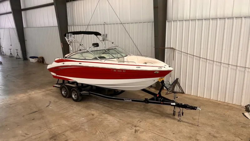 Slide: The Image of 2013 Cruisers Yachts 258 Sport Series boat in warehouse. - 8