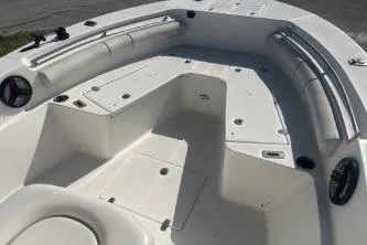 Slide: The Image of 2022 Sea Born LX24 Center Console boat interior with seating and storage compartments. - 10