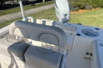 Slide: The Image of 2022 Sea Born LX24 Center Console boat interior with seating and storage. - 11