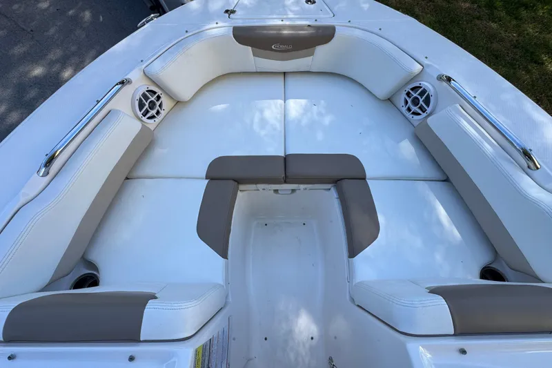 Slide: The Image of 2022 Robalo R207 Dual Console boat interior with cushioned seating and speakers. - 12