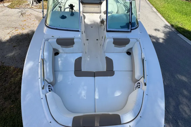 Slide: The Image of 2022 Robalo R207 Dual Console boat with spacious seating and open deck design. - 13