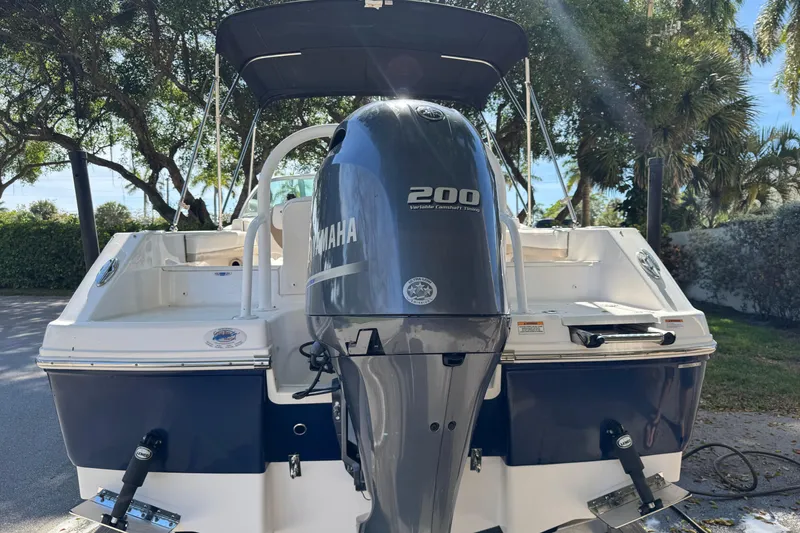 Slide: The Image of 2022 Robalo R207 Dual Console boat with Yamaha 200 engine, parked outdoors. - 3