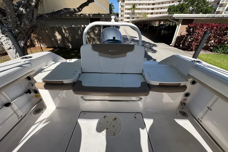 Slide: The Image of 2022 Robalo R207 Dual Console boat interior with seating and storage compartments. - 6