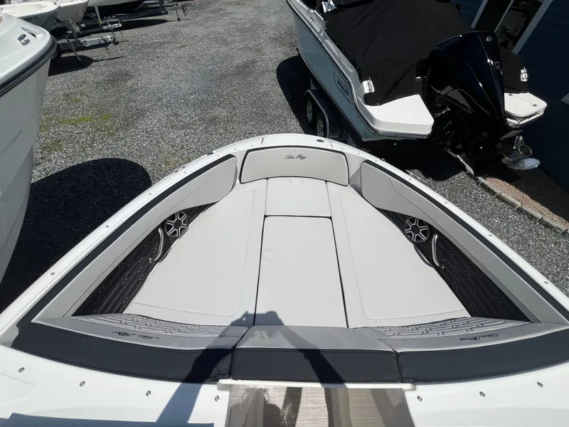 Slide: The Image of Bow of a Sea Ray SPX 210 Outboard with gray cushions and speakers. - 13