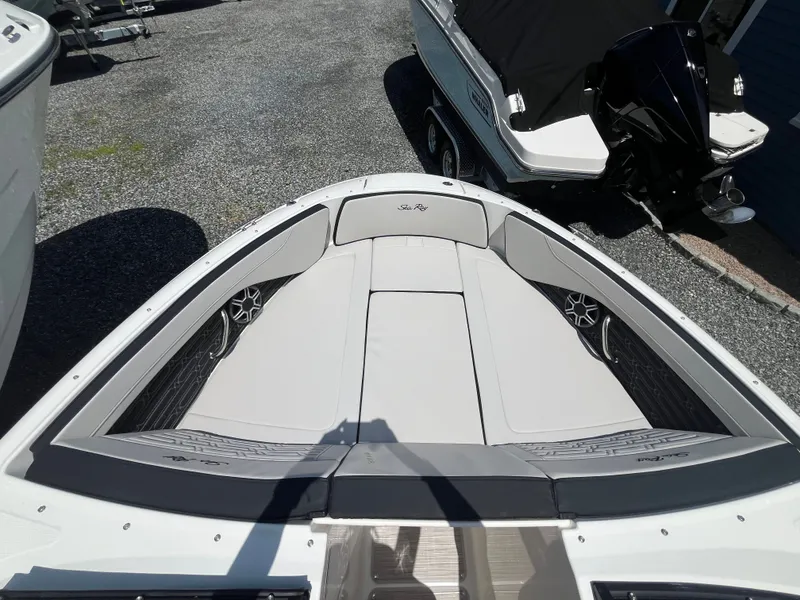Slide: The Image of Bow of a Sea Ray SPX 210 Outboard with gray cushions and speakers. - 14