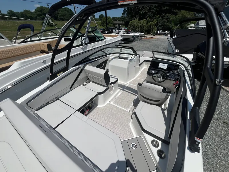 Slide: The Image of The image shows the cockpit of a 2026 Sea Ray SPX 210 Outboard boat. - 4