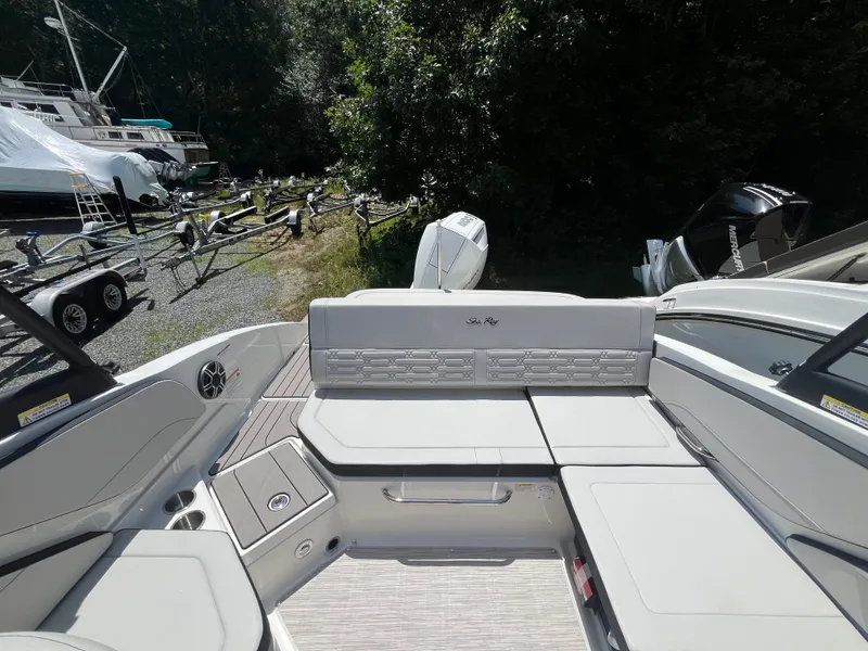 Slide: The Image of The image shows the cockpit of a 2026 Sea Ray SPX 210 Outboard boat. - 3
