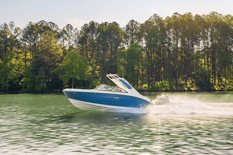 Slide: The Image of 2026 Sea Ray SDX 230 Outboard cruising on a serene lake. - 1