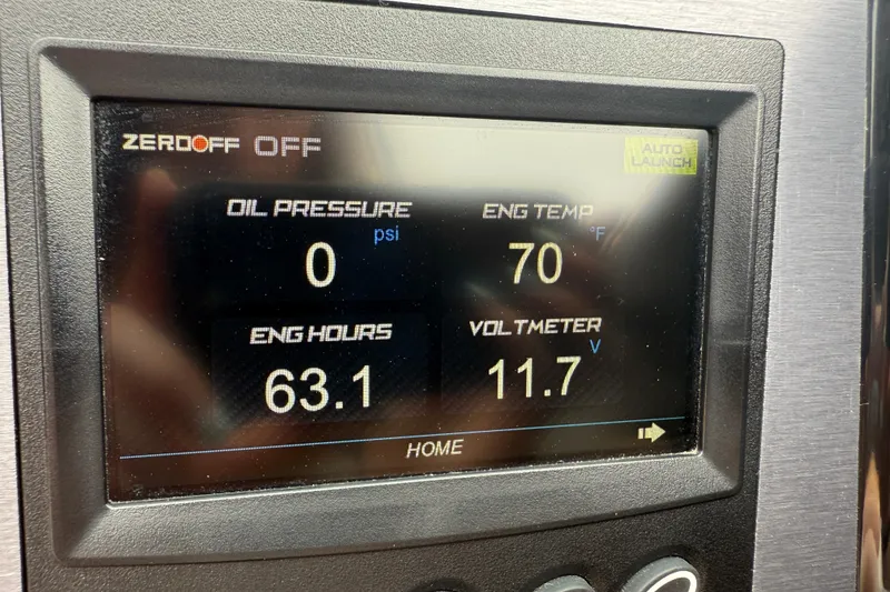 Slide: The Image of Dashboard display of a 2022 MasterCraft NXT22 showing engine metrics and settings. - 11
