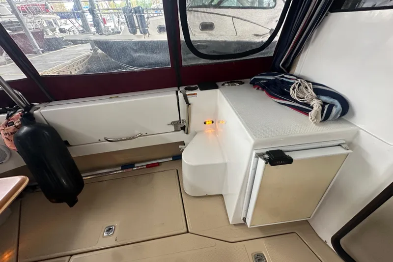 Slide: The Image of Interior view of 2018 Ranger Tugs R-31 S boat with seating and storage. - 12