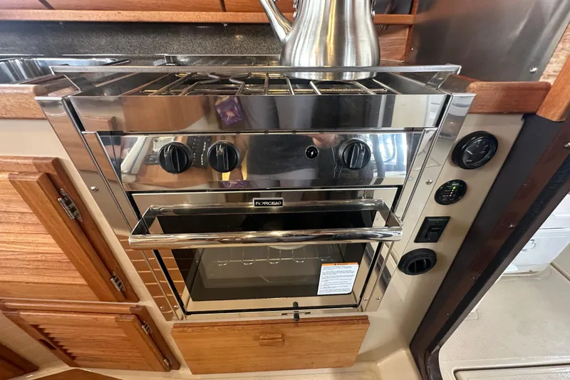 Slide: The Image of Stainless steel oven in 2018 Ranger Tugs R-31 S boat kitchen interior. - 27