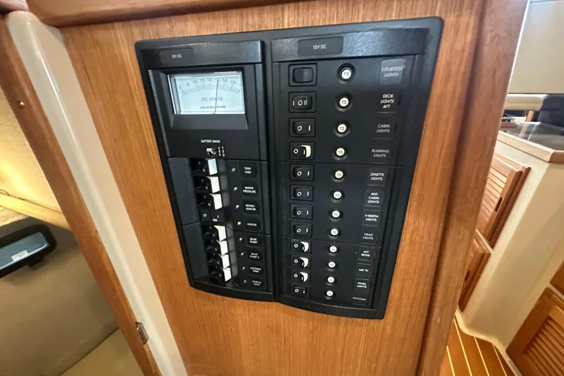 Slide: The Image of Electrical control panel on 2018 Ranger Tugs R-31 S boat, featuring switches and voltage meter. - 28