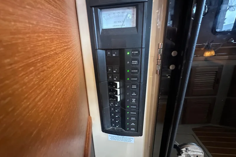 Slide: The Image of Electrical panel on 2018 Ranger Tugs R-31 S boat, featuring various switches and voltage meter. - 30