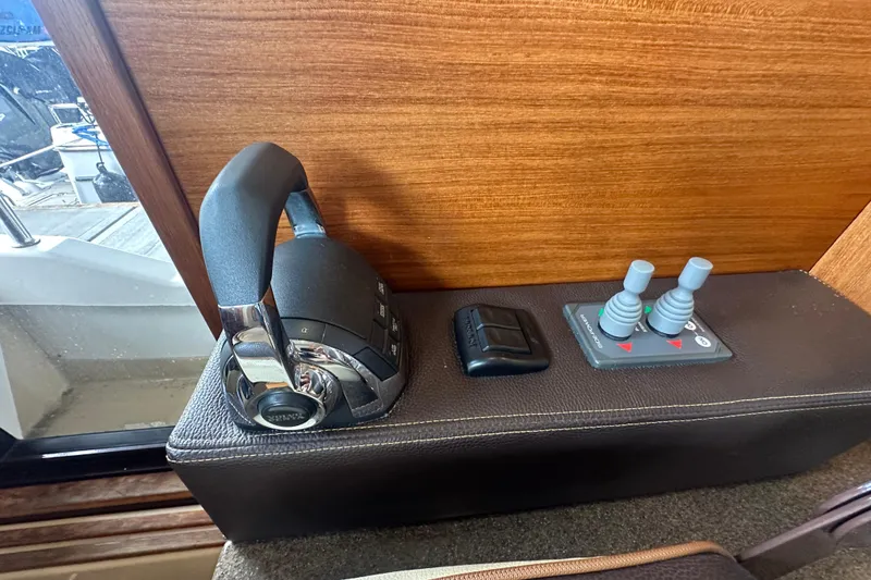 Slide: The Image of Control panel of 2018 Ranger Tugs R-31 S boat with throttle and joysticks. - 37