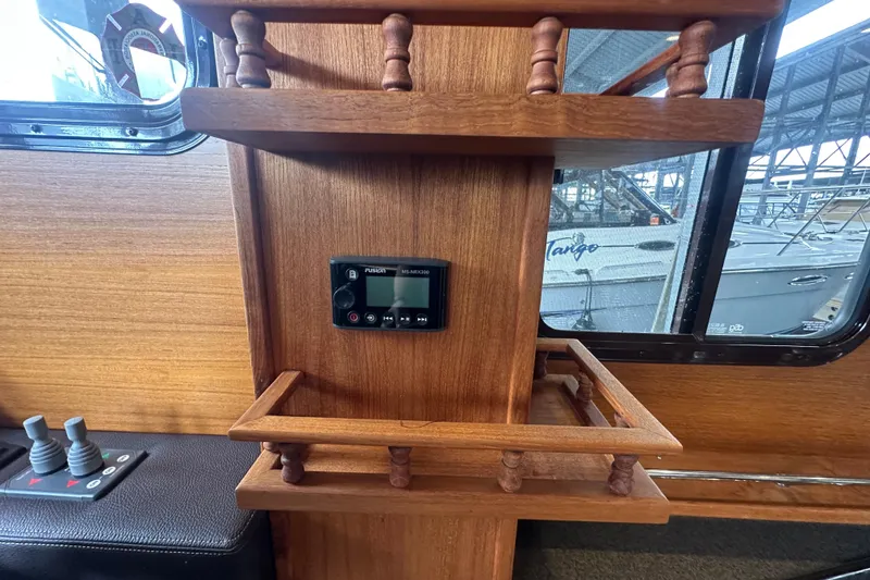 Slide: The Image of Interior of 2018 Ranger Tugs R-31 S with wooden shelving and Fusion MS-NRX300 stereo. - 40