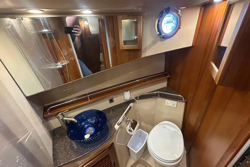 Slide: The Image of Luxurious 2018 Ranger Tugs R-31 S bathroom with modern fixtures and elegant wood accents. - 45