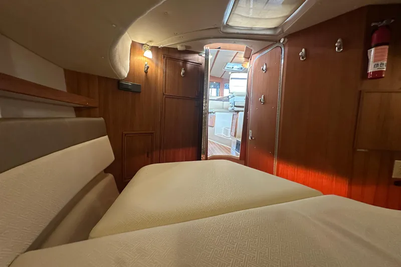 Slide: The Image of Interior cabin of 2018 Ranger Tugs R-31 S with cozy seating and wooden paneling. - 46