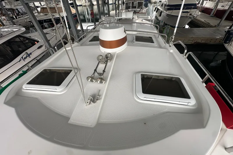 Slide: The Image of 2018 Ranger Tugs R-31 S boat deck with hatches and railing in marina. - 6